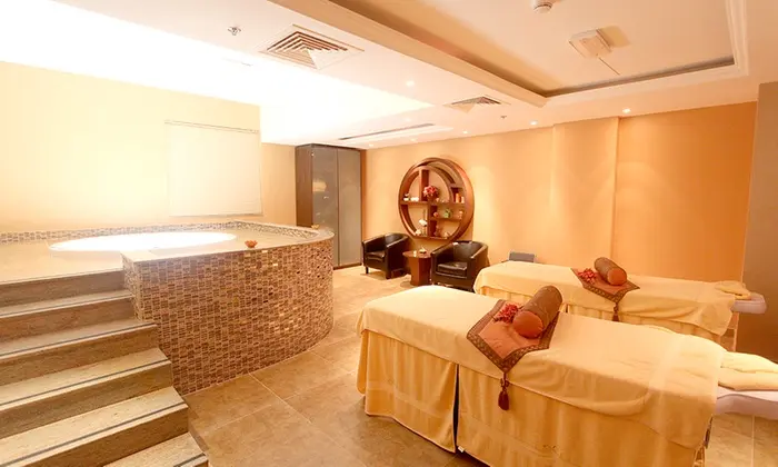 Luxury massage room in Orange Spa Dubai with elegant decor and relaxing ambiance.